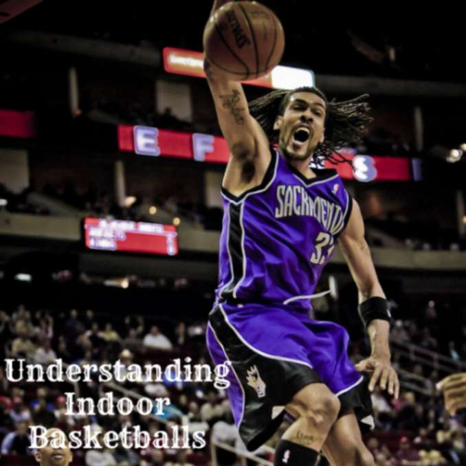 a basketball player in a purple uniform dunking a basketball