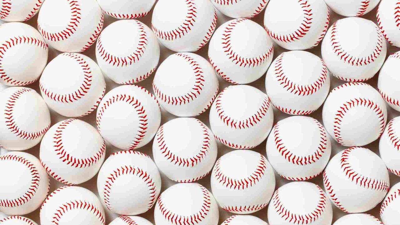 A group of baseballs, impacted by the rising major league baseball costs, awaits the next game.